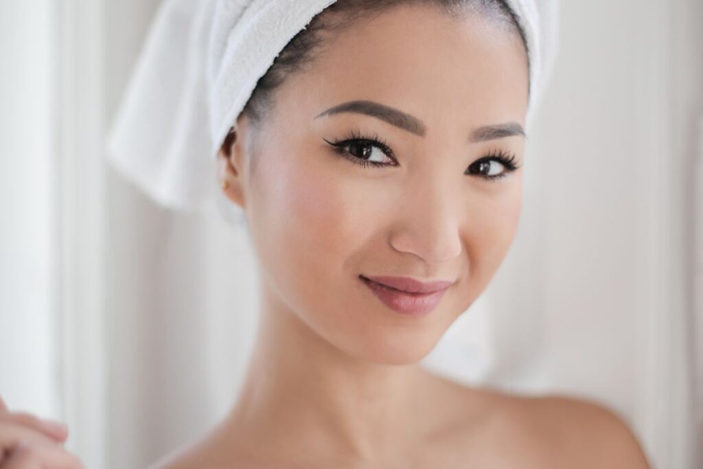 Woman doing gentle facial skincare after facial hair removal
